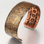 Stamp-patterned mokume gane bracelet by Anne Wolf
